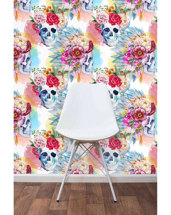 Watercolor skulls with dense floral crowns in magenta and rose, set against a pastel backdrop. This removable wallpaper adds a bold artistic touch to any room needing personality.